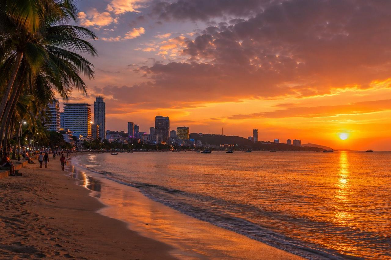 Pattaya bay at sunset, looking down the beach from Beach Road